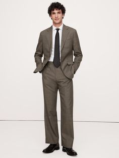 This sophisticated Italian wool suit pant is cut from a luxurious and historical wool fabric—one we love for its distinctive balance between an open weave and a tighter tension yarn, which gives it the ability to remain breathable while always looking pulled-together.  Breathable, Wrinkle-Resistant Tailored Straight Fit: High-rise with a straight leg.  Fabric from Italy's Vitale Barberis Canonico.  Zip fly with button-tab closure.  Front, back and ticket pockets.  Lined to the knee.  Tailored St Suit Pant, Open Weave, Wool Suit, Wool Fabric, Straight Leg Pants, New Woman, First Look, The Knee, Banana Republic