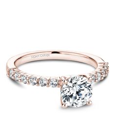 a rose gold engagement ring with diamonds on the band