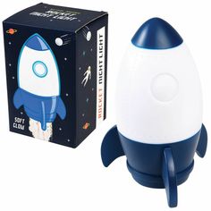 a blue and white rocket ship next to a box