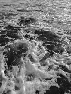 black and white photograph of waves in the ocean