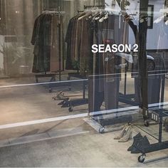 there is a window display with clothes in it