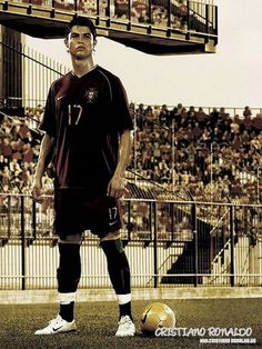 a man standing in front of a soccer ball