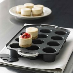 there is a muffin pan with cupcakes on it