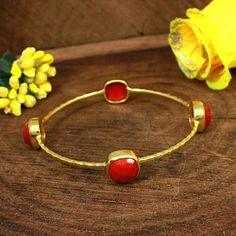 Red Coral Bracelet Vintage-Red Stone-Stone Bracelet-Gold Plated Hammered Bangle- 10x10 MM Rose Cut Cushion Coral Bangle- Handmade Bracelet ------------------------------------------- Description : Item Code : EMS-1739 Gemstone : Synthetic Red Coral Metal : Brass Plating : Please select from variation. Stone Size : 10 x 10 MM Approx Weight : 11.49 Gram Approx Handmade Item **Made To Order** ---------------------------------------------- For more beautiful designs please visit our Etsy shop below: Red Stackable Bangle Jewelry, Red Stackable Bracelet Jewelry, Red Stackable Bracelet, Red Gemstone Bangle Cuff Bracelet, Red Gemstone Cuff Bracelet, Adjustable Red Stackable Jewelry, Simple Bangle, Hammered Earrings, Black Beaded Jewelry