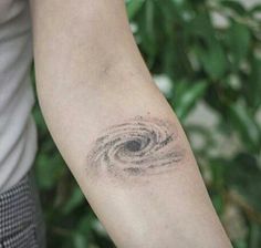 a close up of a person's arm with a tattoo on it