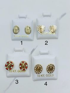 10k gold earrings studs Virgin Mary  Virgen Maria Studs 10mm long  Screw back Yellow gold with red & white cubic zirconia  2 styles availabe - each sold separetly  Aretes de oro de la Virgen María  Pequeños miden 10 milímetros Oro de 10k con piedra zirconia blanca y roja  Tornillo  Dos colores disponibles - Cada uno se vende por separado  New 14k Gold Screw Back Jewelry, Gold Screw Back Jewelry For Gifts, Gold Jewelry With Screw Back, Gold Screw Back Round Jewelry, Our Lady Of Guadalupe, Lady Of Guadalupe, Earrings Studs, Screw Back Earrings, Our Lady