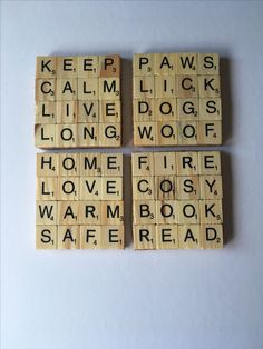 three scrabble tiles with words that spell out the word keep calm, i love dogs