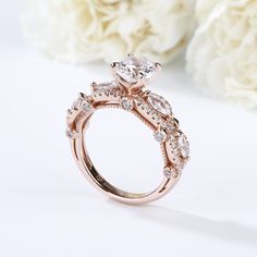 She is the type of person that makes forever seems too short. Treat beloved her to this stunning ring that celebrates your endless love and passion. This design features a shimmering round cut stone at the center, while marquise cut stones and additional round stones decorate the twisting shank. With rose gold color and milgrain on the shank,this ring shows a really elegant and exquisite on her finger. Carat Weight: 2.5 ctStone Size: 7 mmStone Type: Jeulia® StoneNumber of Stones: 1 Stone Color: Diamond WhiteStone Shape: RoundCarat Weight: 0.933 ctStone Size: 1.1,1.5,2,3*1.5 mmStone Type: Jeulia® StoneNumber of Stones: 63 Stone Color: Diamond WhiteStone Shape: Round, MarquiseWeight: 5.1 gWidth: 6.44 mmHeight: 8.32 mmThickness: 2.46 mmMaterial: 925 SilverPlating Color: Rose Gold Diamond White Marquise Cut Stackable Rings For Anniversary, Marquise Cubic Zirconia Stackable Rings For Anniversary, Elegant Rose Gold Bridal Sets For Anniversary, Marquise Diamond Crystal Ring For Anniversary, Dazzling Marquise Diamond Promise Ring, Marquise Cut Cubic Zirconia Stackable Wedding Rings, Anniversary Marquise Cut Cubic Zirconia Stackable Rings, Elegant Solitaire Flower Ring For Wedding, Anniversary Stackable Marquise Cut Cubic Zirconia Rings