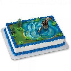 there is a cake with a horse in the water on it's side and blue icing