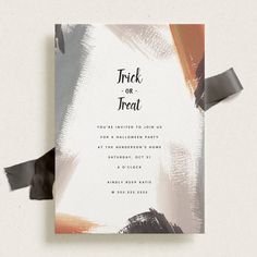 a white and black wedding card with the words trick or treat on it