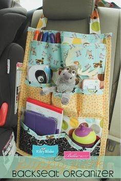 the back seat organizer is organized and ready to be used for baby's carseat