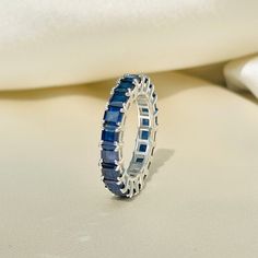 Blue Sapphire Eternity Band, Sapphire Eternity Ring, Minimalist Ring, Stackable Ring, Wedding Band, Gemstone Ring, Gift Idea, Gift for Her Diri Jewels 1. Product Details ✧ Material : High Quality Solid 925 Sterling Silver ✧ Color Options: 14K Gold, 14K White Gold ✧ Stone Type: Simulated Blue Sapphire 2. Shipping & Packaging Details ☐ Dispatches in 4 - 8 business days ☑ Multiple shipping speeds available 3. Custom Orders Its simple, just get in touch with us and we'll take care of the rest. 4. Re Sapphire Eternity Band Stacked, Hand Goals, Blue Sapphire Eternity Band, Eternity Band Stack, Sapphire Band Ring, Sapphire Eternity Band, Sapphire Eternity Ring, Gemstone Rings Vintage, Stack Rings