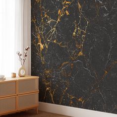 a black and gold marble wallpaper in a living room with a white window sill