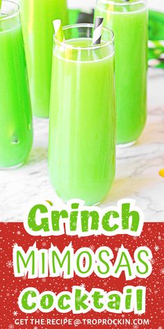 three glasses filled with green drinks on top of a table