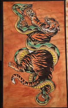 an image of a tiger and snake painted on wood