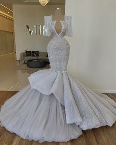 a white gown on display in a room