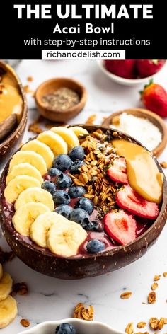 a bowl filled with fruit and nuts on top of a white table next to other bowls