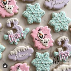 some decorated cookies are sitting on a table