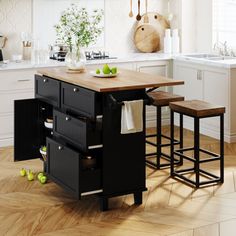 an island in the middle of a kitchen with two stools on top of it