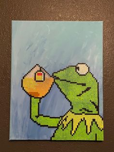 a painting of a frog holding a piece of bread