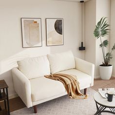 a living room filled with furniture and a white couch