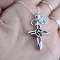 "This gorgeous sterling silver cross designed with a swirling Celtic knot that signify everlasting love, which emphasizes the endlessness of love of God, as well represents friendship, affection, that cannot be broken; also signifies the four elements of its four arms; earth, water, air and fire; four parts of a human; body, Mind, heart and soul. Celtic crosses emphasize more about beauty rather than pain when crosses depict the crucifixion itself. DON'T LOSE IT, save it to revisit it later by c Personalized Sterling Silver Cross Pendant Necklace, Personalized Sterling Silver Pendant Cross Necklace, Spiritual Sterling Silver Cross Necklace, Silver Cross Necklace For Mother's Day, Silver Cross Pendant Necklace For Mother's Day, Mother's Day Sterling Silver Cross Necklace, Sterling Silver Cross Pendant Necklace For Memorial, Sterling Silver Cross Necklaces For Mother's Day, Sterling Silver Cross Necklace With Birthstone