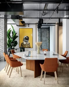 a large table with chairs around it in an office