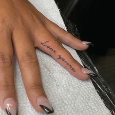 a woman's hand with the word love on it and her name written in cursive writing