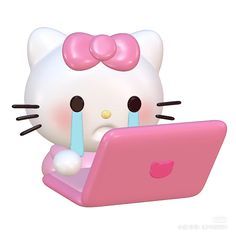 a hello kitty figurine sitting on top of a pink laptop computer with its eyes closed