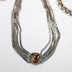 A silver-tone necklace with multiple box-chain strands that meet with a topaz emerald cut crystal. Snow Bunny, Giddy Up Glamour, Silver Necklace Statement, Snow Bunnies, Tennis Necklace, Pretty Stuff, Necklace Statement, Box Chain, Emerald Cut