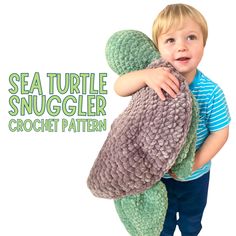 a little boy holding onto a stuffed turtle toy with the words sea turtle snuggler crochet pattern