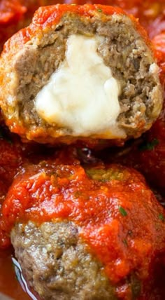 meatballs stuffed with cheese and marinara sauce in a bowl