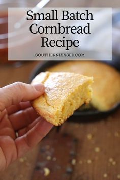 a hand holding a piece of cornbread in front of a skillet with the words, small batch cornbread recipe