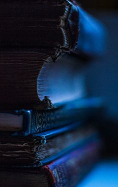 a stack of books sitting on top of each other