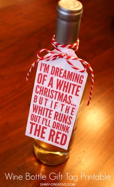 a bottle with a tag on it that says i'm dreaming of a white christmas but if he runs out i'll drink the red