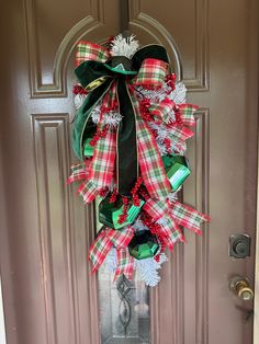 a christmas wreath hanging on the front door