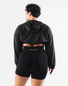 HIGHLIGHTS. Woven fabric Long sleeve Alphalete wolf logo FIT SUGGESTION. This item runs true to Alphalete's standard size... Jessica is 5’3”/160cm, wearing a size XS with a 30”/77.5cm bust. Sabrina is 6’0”/183cm, wearing a size XL. with 44.5"/113cm bust. MATERIALS AND WASHING DIRECTIONS. 100% Polyester. We recommend washing inside-out on a cold setting. Hang to dry DESCRIPTION With a silky smooth woven fabric, this jacket is perfect for wearing to and from the gym or during a cold outdoor workou Wolf Logo, Keep Your Cool, Crop Jacket, The Gym, Athleisure, Inside Out, Woven Fabric, Long Sleeve, How To Wear