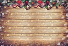 a wooden background with christmas decorations and lights