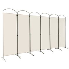 four partitions with metal legs and white canvas panels on each side, set against a white background