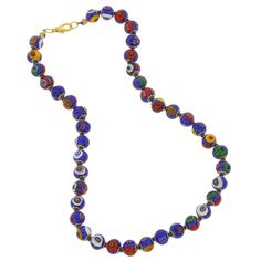 This beautiful Murano Glass Millefiori necklace offers classic Venetian style and effortless chic. Centuries-old Murano glass decorative technique perfected by Italian craftsmen is used to create colorful mosaic effect that is fun and trendy, yet classic and timeless. This necklace is a unique accessory that will add glamour and elegance to your look. Measurements: This necklace measures 15 to 16 inches in length and comes with an attractive velvet pouch and a certificate of authenticity. Becaus Multicolor Murano Glass Round Necklace, Blue Glass Necklace With Colorful Beads, Blue Glass Necklaces With Colorful Beads, Elegant Multicolor Glass Necklaces, Blue Single Strand Murano Glass Beaded Necklace, Blue Round Glass Necklaces, Blue Glass Round Necklaces, Traditional Blue Glass Necklaces, Traditional Single Strand Glass Necklace