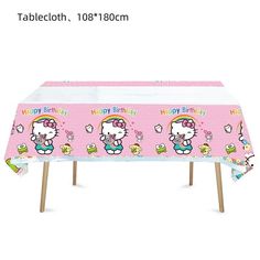 a tablecloth with hello kitty on it and the name happy birthday written on it