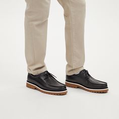 Our Banks Boot is a lace-up loafer style that makes a versatile addition to your wardrobe. This men's shoe features a leather upper man-made leather lining and footbed and a sturdy rubber outsole for traction and comfort. With its convenient pull tab this boot is easy to put on and wear throughout your day. Its sleek design and subtle piping detail add a touch of sophistication to any outfit—whether you're heading to the office or out for a casual evening. Wear these boots with your favorite tro Sling Bag Mini, Coach Boots, Loafer Style, Go For A Walk, Skirts And Dresses, Casual Evening, Dress Boots, Men's Shoe, Loafers Style