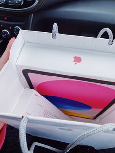 the inside of an apple box is open and ready to be packed into someone's car