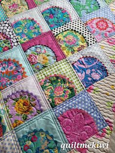 a colorful quilt with many different designs on it's sides and the words, patchwork