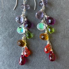 second version! Similar to the original anniversary earrings with one gem switch and no rondelles. And a lower price! Also added metal choices. 😀 I created these colorful dangles to celebrate being a jewelry designer for 12 years in 2020! Thank you to all of my wonderful customers for the support! They have become a bit of a cult fave. These are made in sterling silver wire with amethyst, citrine, quartz, fire moonstone and more! The apprx. length is 2.5" . Please choose your earwire preference Handmade Briolette Earrings For Anniversary, Multicolor Sterling Silver Drop Jewelry, Multicolor Drop Sterling Silver Jewelry, Rainbow Dangle Earrings For Everyday, Rainbow Sterling Silver Jewelry With Ear Wire, Rainbow Sterling Silver Dangle Jewelry, Rainbow Sterling Silver Earrings, Silver Briolette Earrings With Birthstone, Handmade Multicolor Earrings For Anniversary