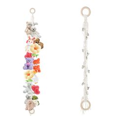 several stuffed animals hanging from hooks on a white wall and in the background is another toy