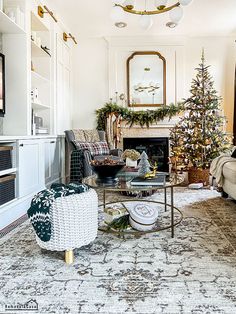 a living room filled with furniture and a christmas tree on top of a coffee table