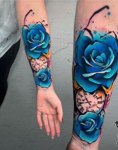 two blue roses are on the arm and one is painted with watercolors, while the