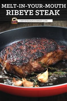 pan - seared ribeye steak in a skillet with garlic and herbs on the side