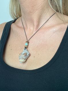 Beautiful, handmade necklace. Necklace made with gemstone beads, coconut beads and 1mm brown waxed cotton cord.  Silver pinch loops and barrel clasp Pendant made from a worn, junior Whelk Shell found on the beaches of ISLE OF PALMS, SC Your jewelry will come in a small drawstring burlap pouch. Brown Hand Wrapped Necklaces For Beach, Beach Hand Wrapped Brown Necklace, Beachy Necklaces, Boho Beach Wear, Whelk Shell, Beachy Necklace, Abalone Shell Necklace, Necklace Shell, Isle Of Palms